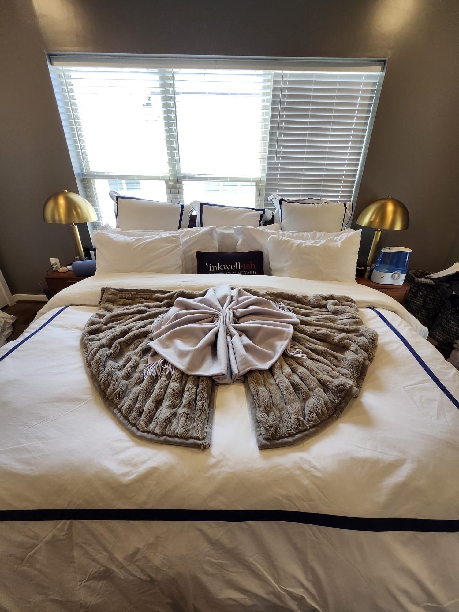Bedroom with White Bedding and Gold Lamps