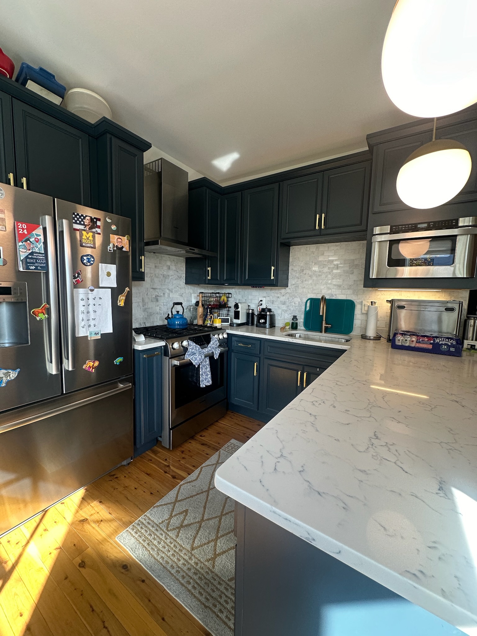 Kitchen with Navy Cabinets & Marble Countertops